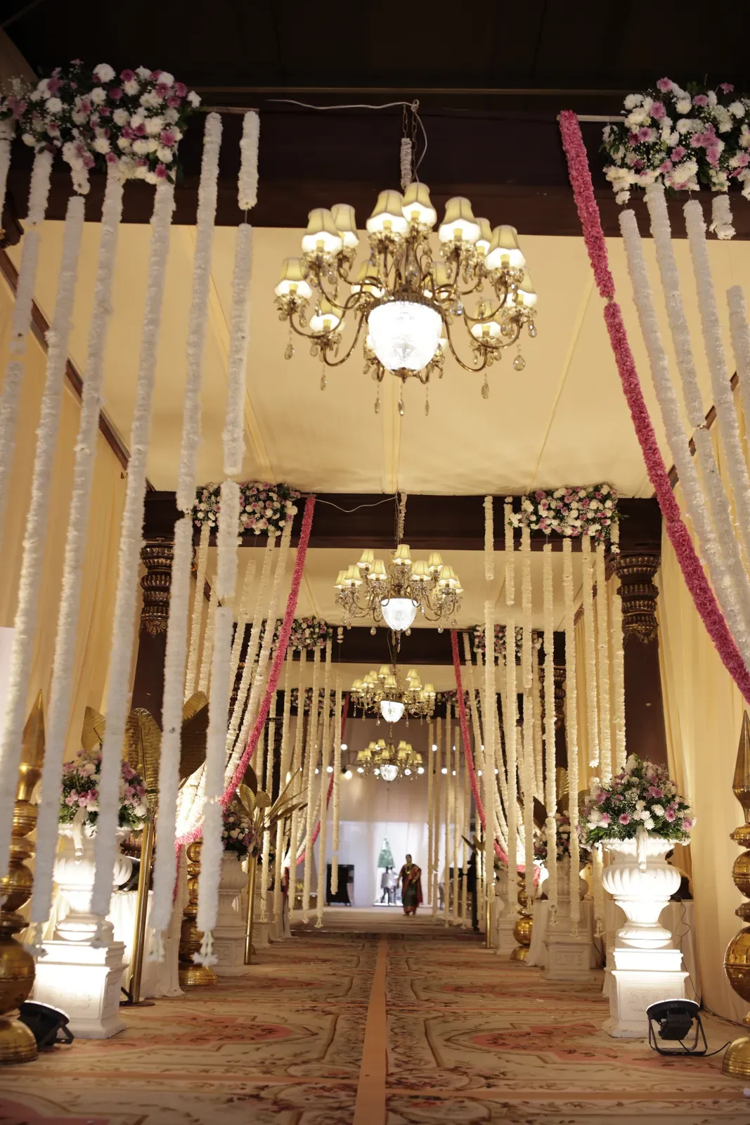 Wedding aisle with chandeliers and floral strings in Hyderabad