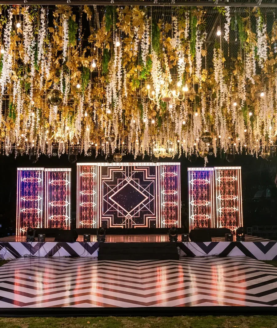Lit stage and dance floor for a sangeet night