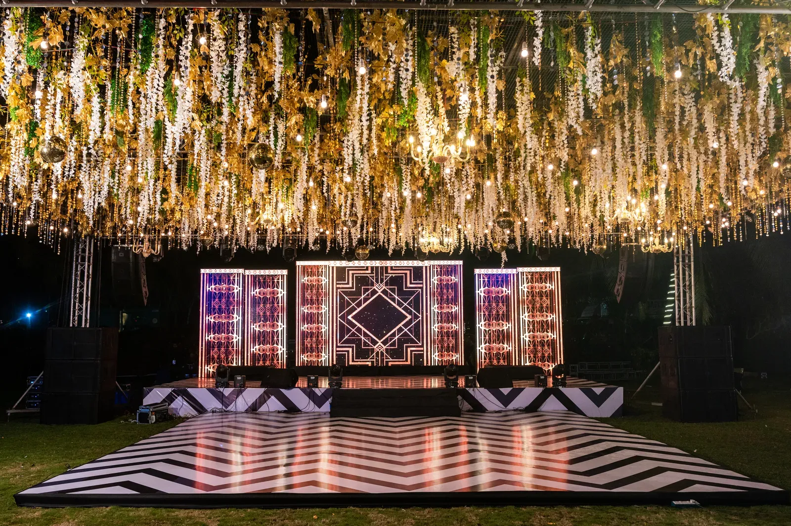 Lit stage and dance floor for a sangeet night